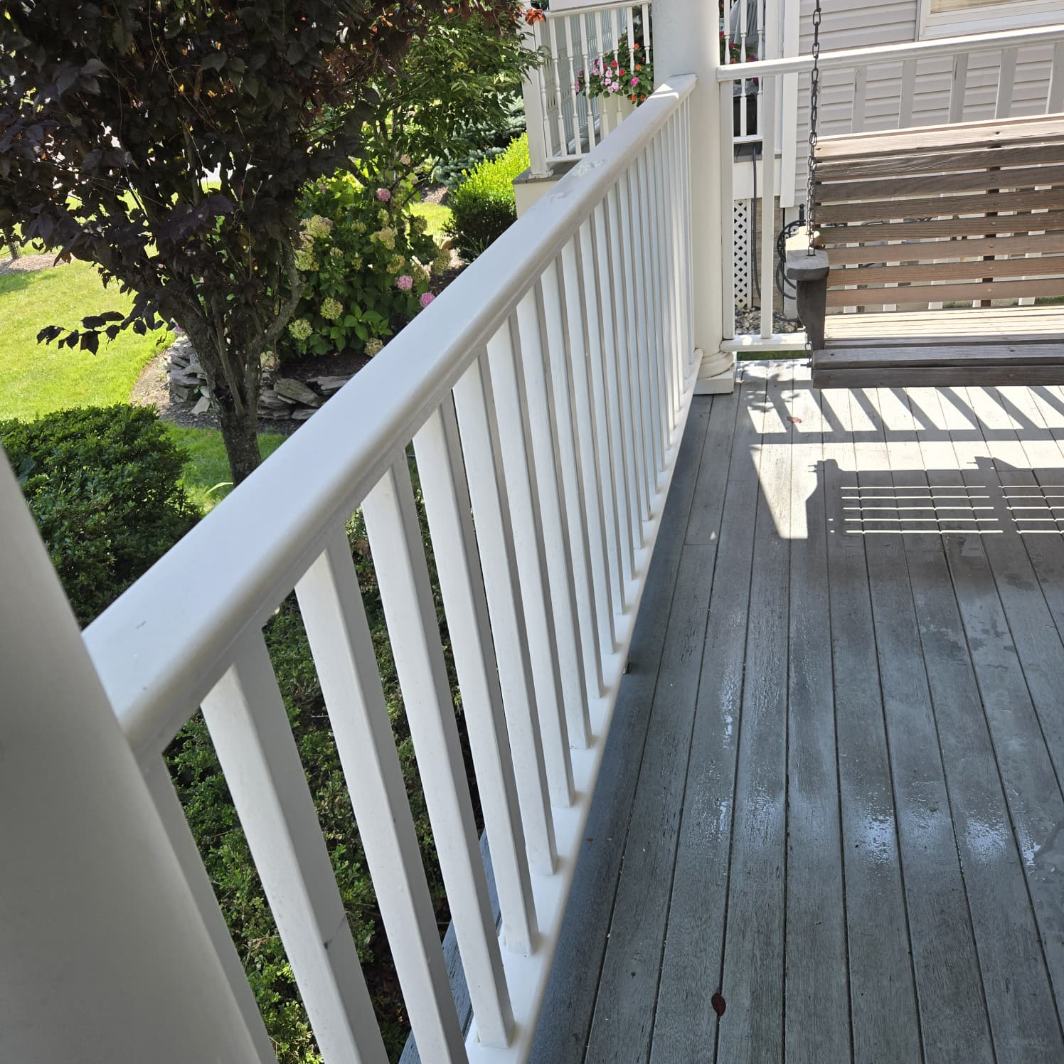 Clean porch railing after power washing