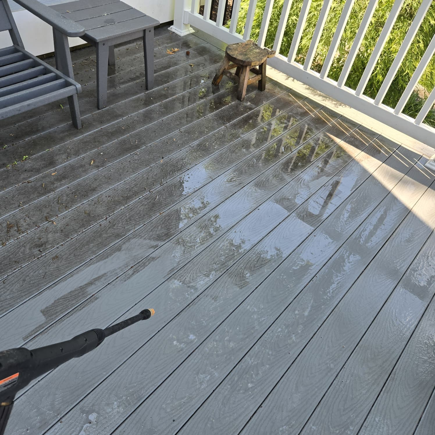 Deck being pressure washed