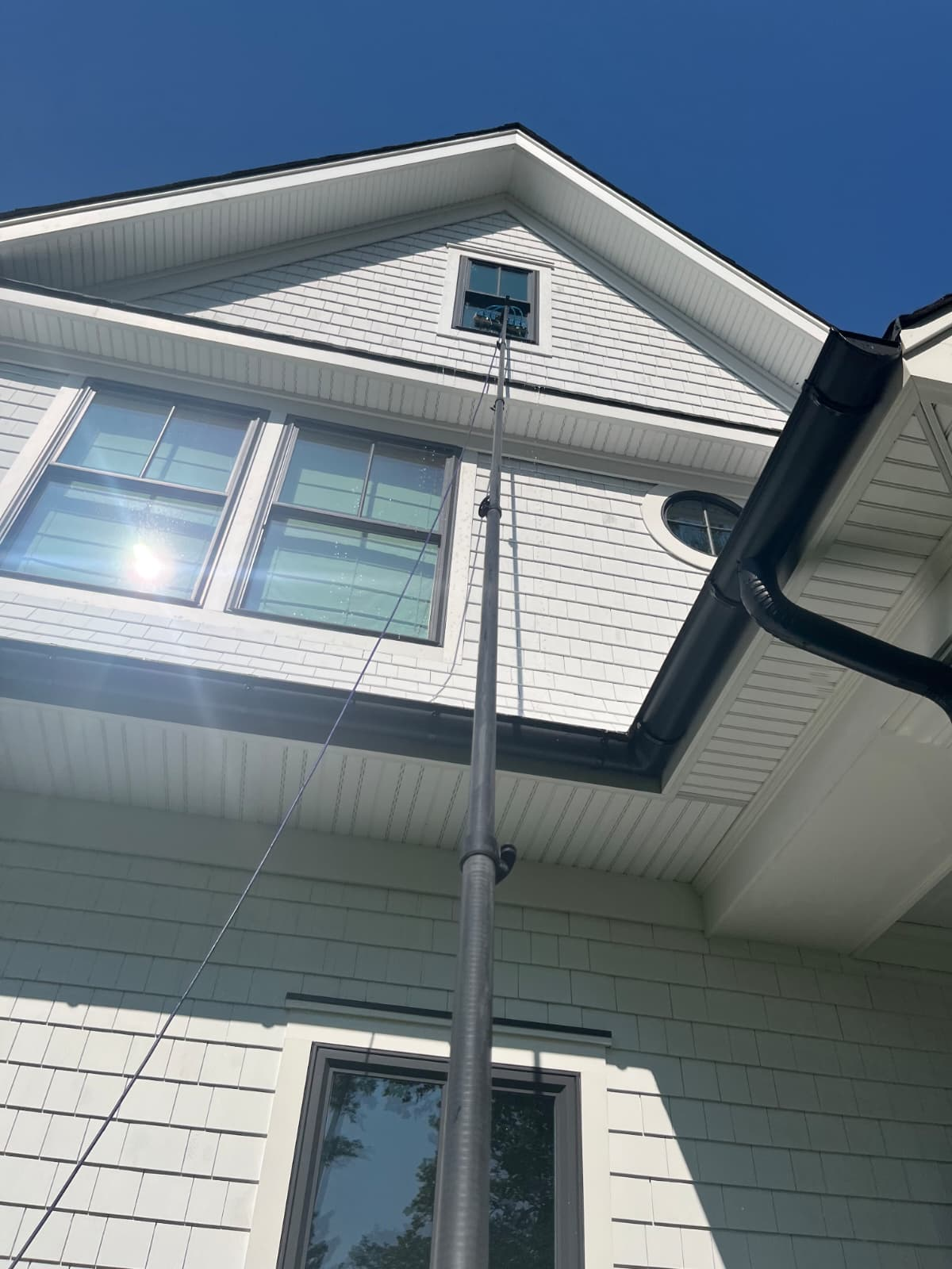 Gutter and upper window cleaning with extension pole